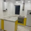 Кухня крашеная с интегрированной ручкой и фурнитурой Blum